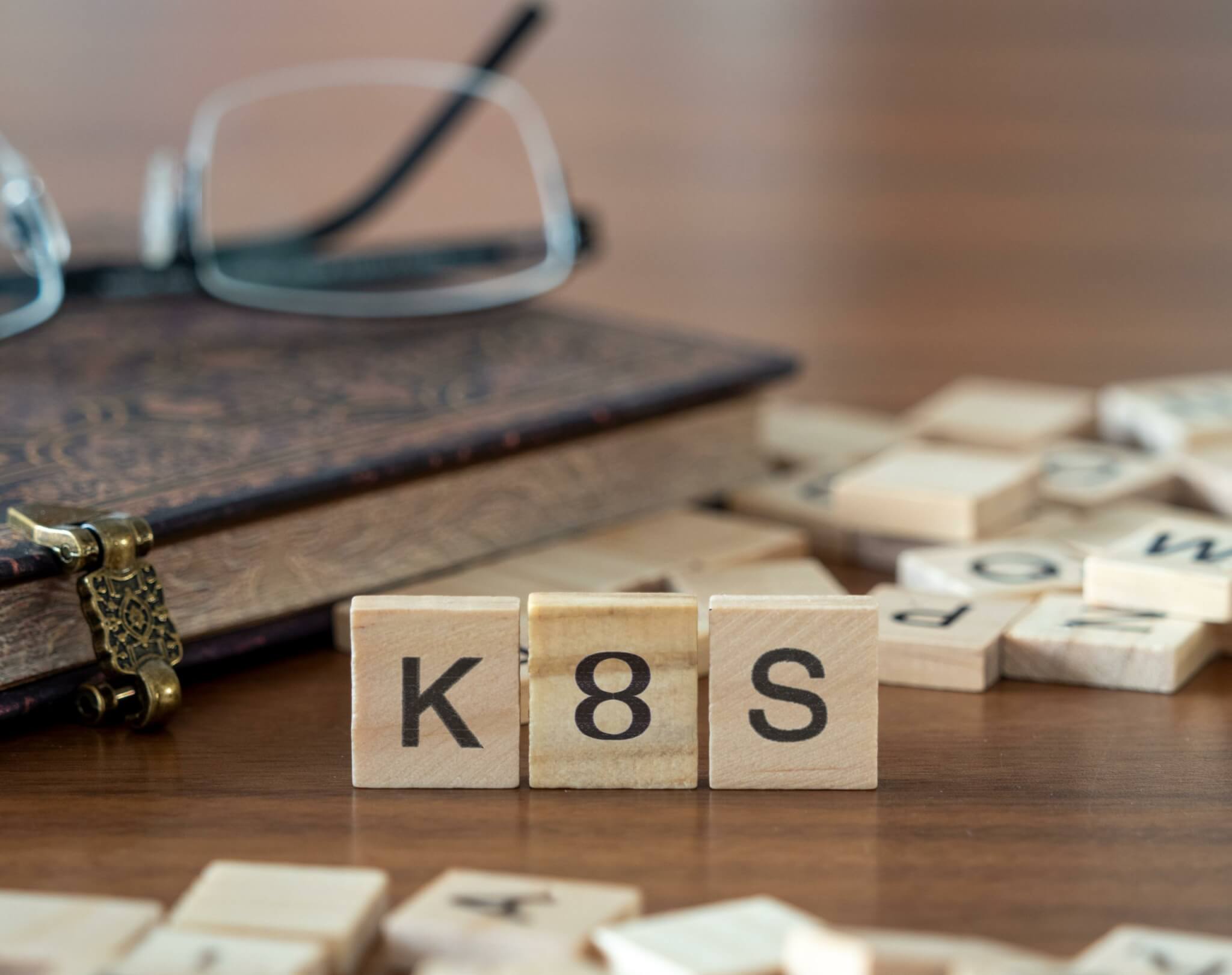 The acronym k8s for kubernetes concept represented by wooden letter tiles